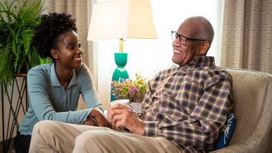 a live-in caregiver in conversation with her care recipient